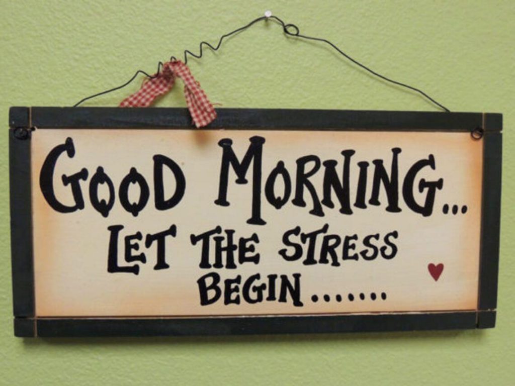A rustic sign that says good morning let the stress begin caregiving