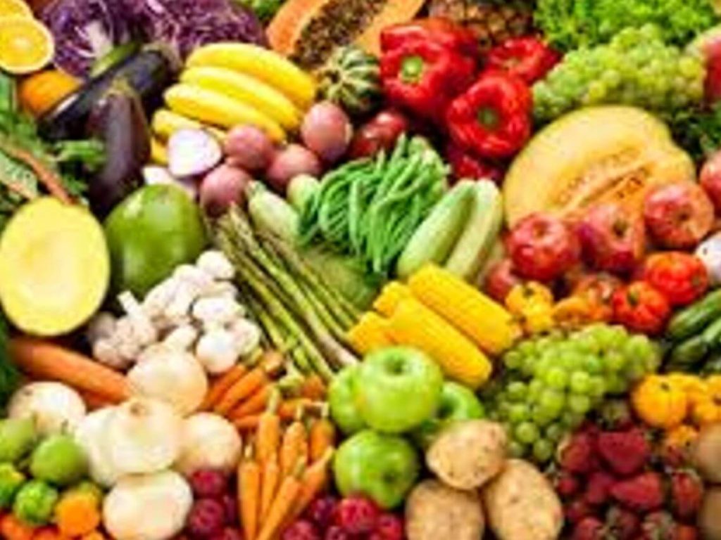 An array of different fruits and veggies that are great for weight loss
