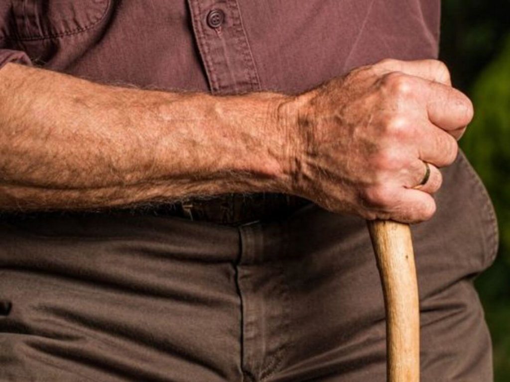 A man holding his cane