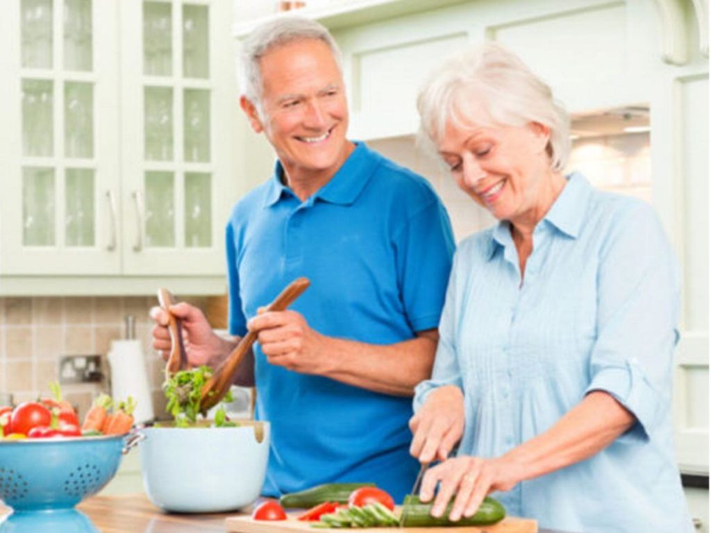 seniors male and female cooking, mental and physical health