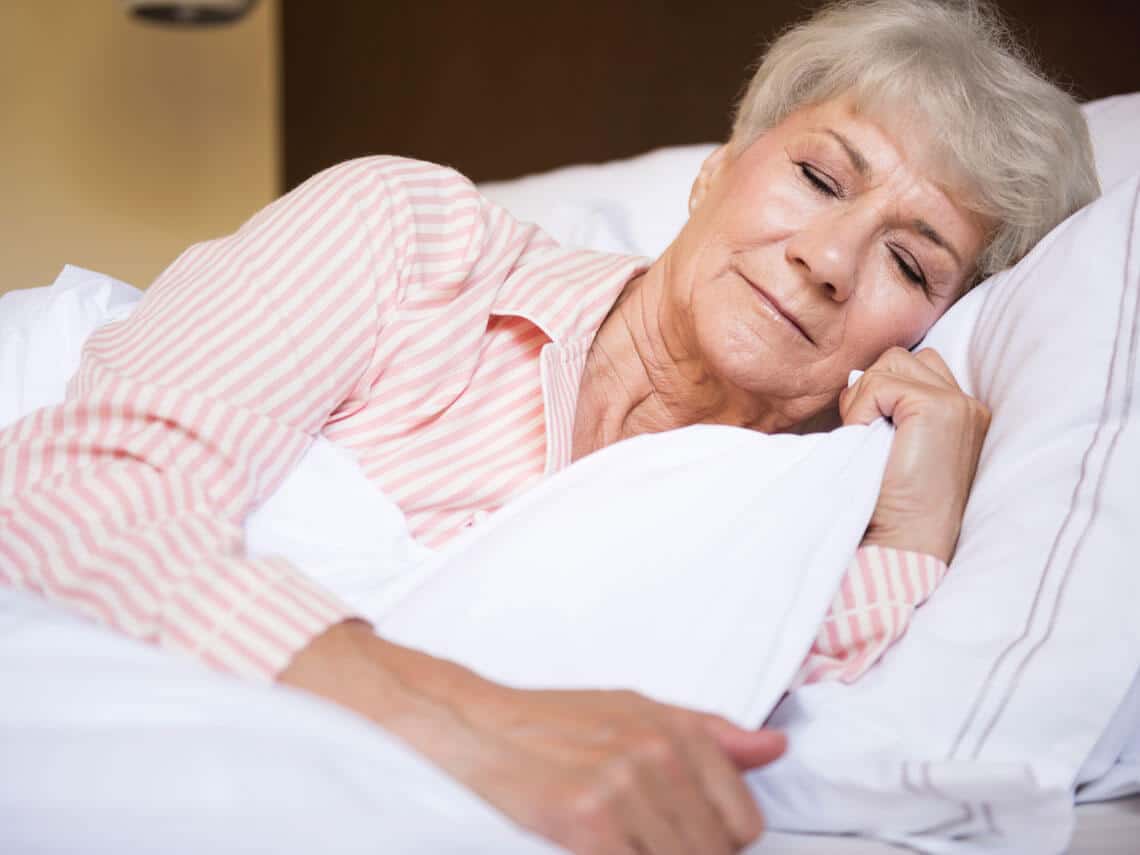 senior woman using tips to sleep better