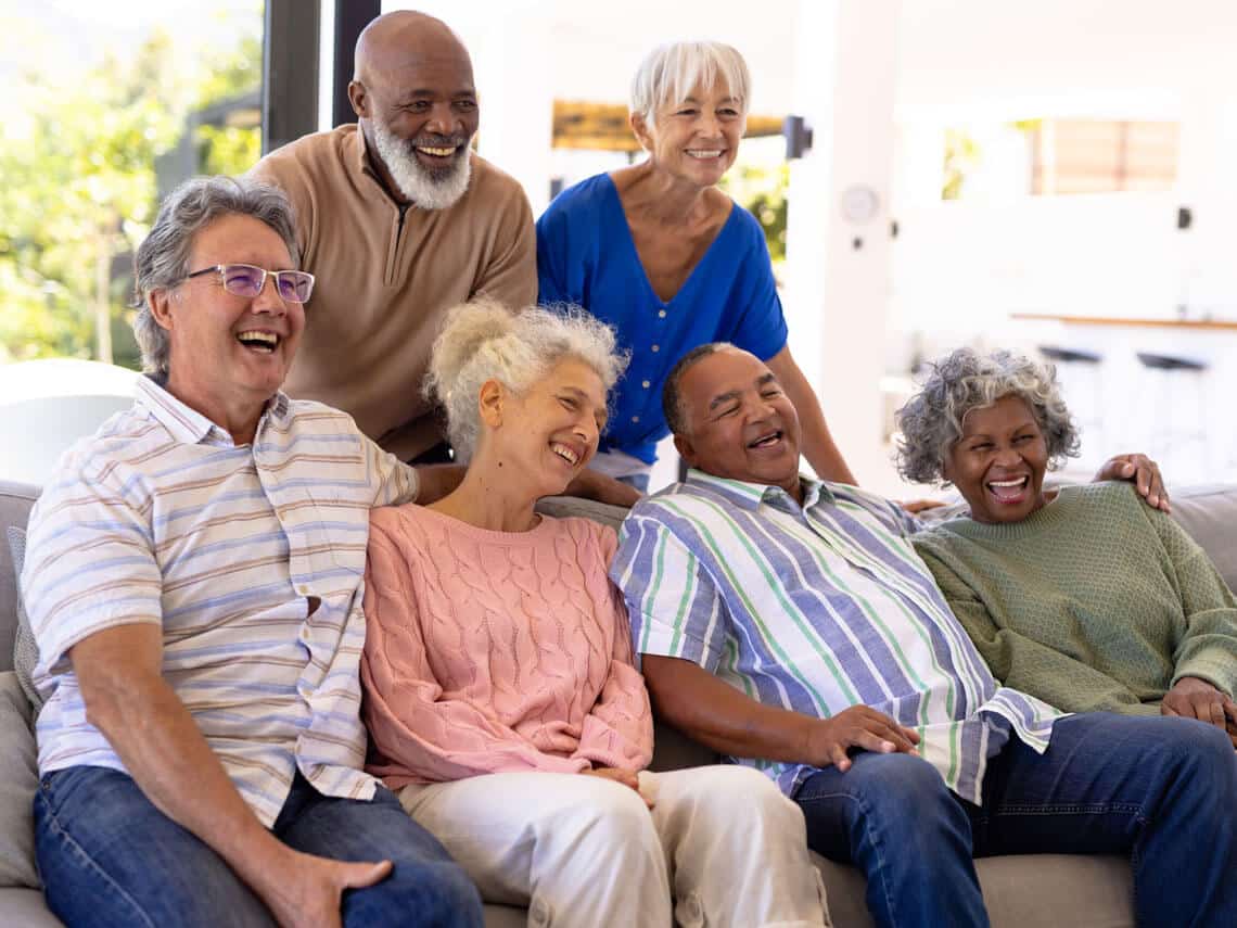 group of seniors cheerful and enjoying social life together