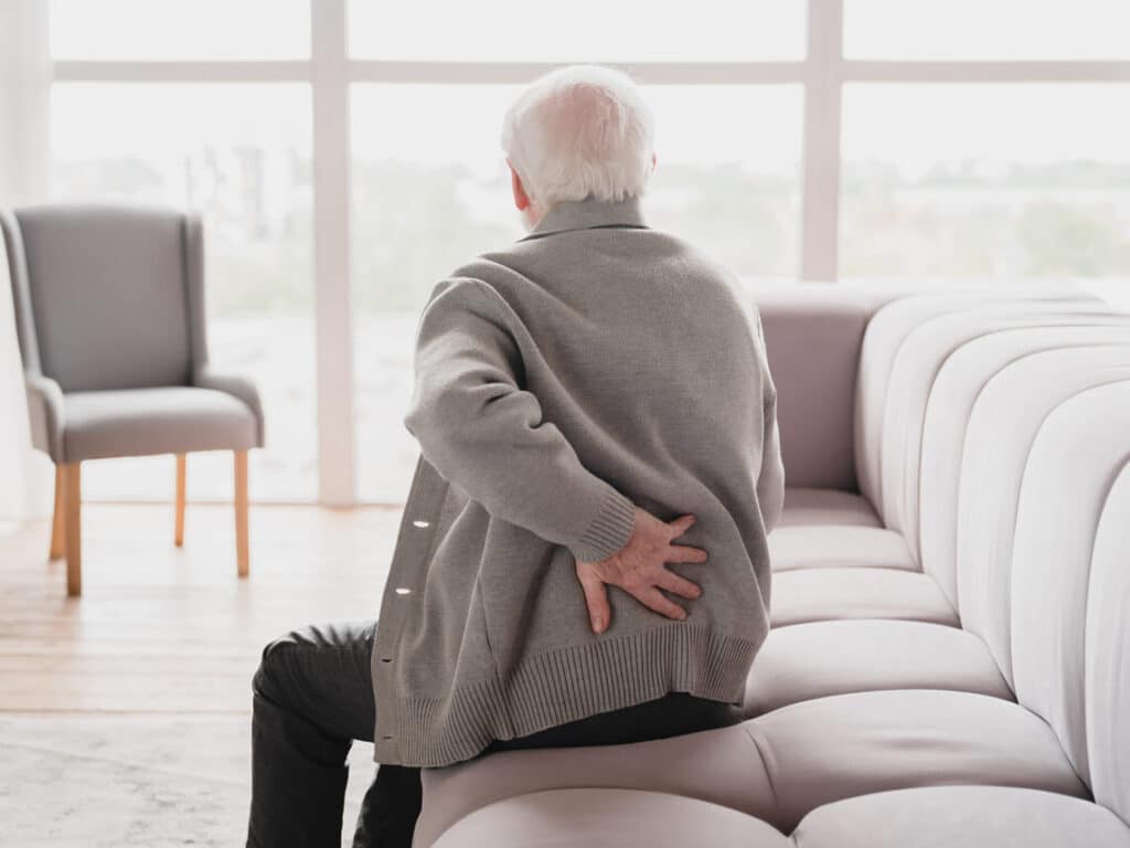 Grandfather suffering from herniated disc