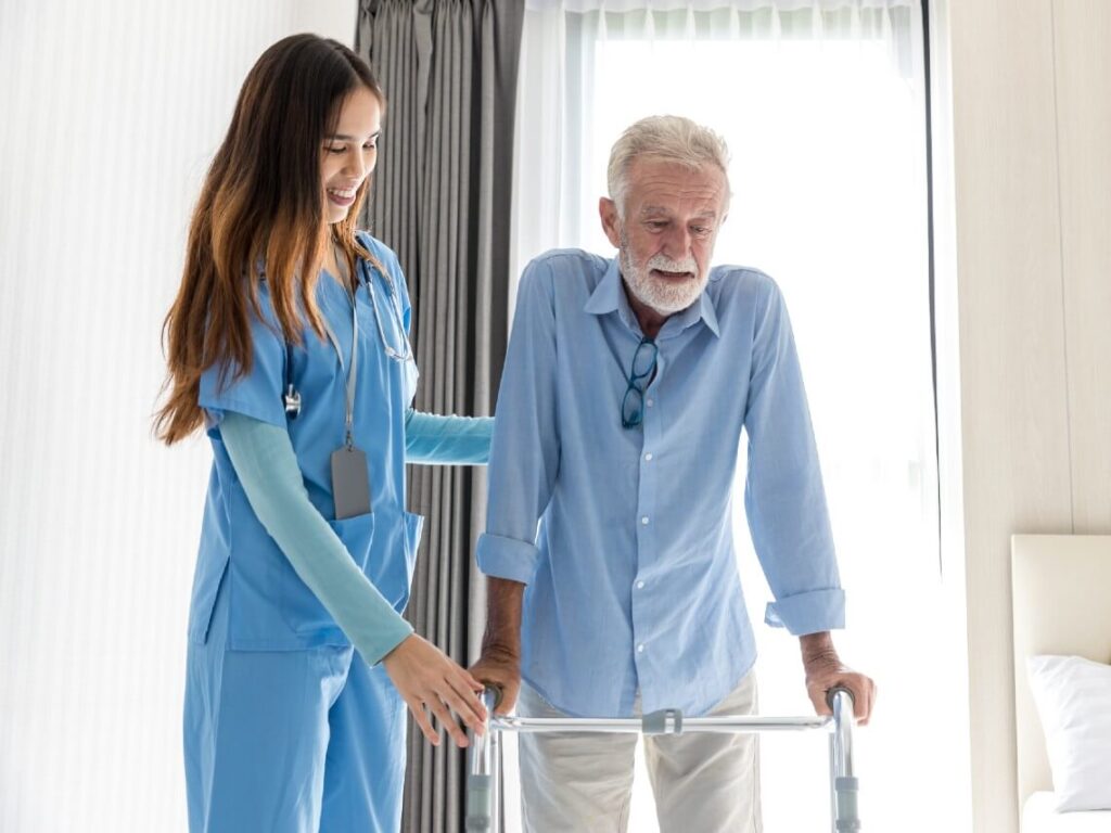 Female nurse taking care of senior male patient